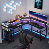 L-Shaped Gaming Desk with Power Outlets & LED Strips, L-Shaped Computer Desk with Storage Shelves, Corner Gaming Desk with Monitor Stand, Black Modern Writing Desk Home Office, Game Room