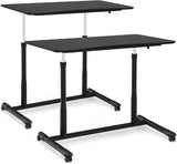 Mobile Height Adjustable Standing Desk, Compact Pneumatic Sit to Stand Up Computer Desk w/ Lockable Wheels, Ergonomic Rolling Laptop Table w/ Steel Frame for Home Office (Brown)